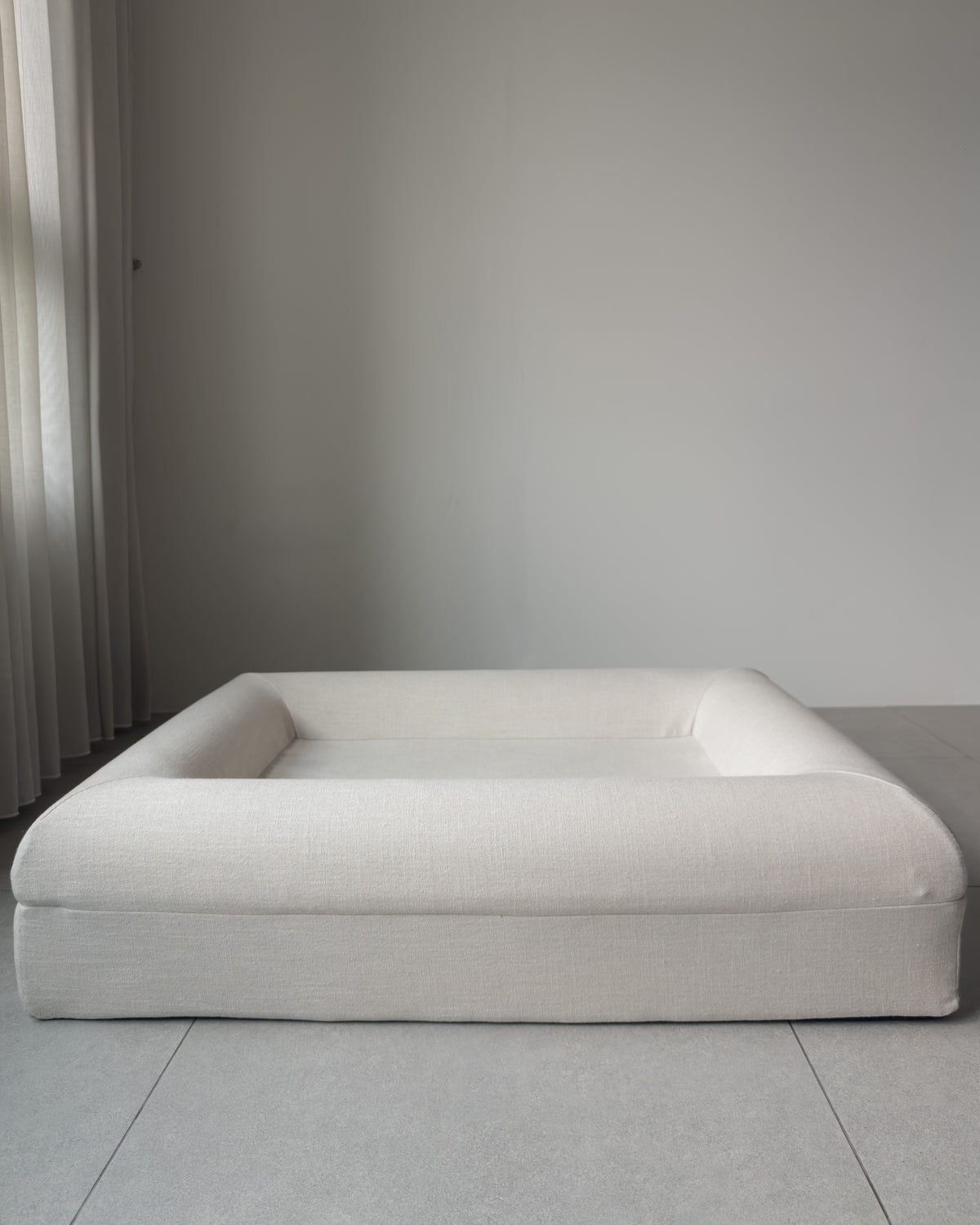 The KINNE Bed in Oat from the front