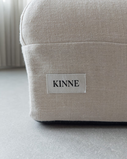 The KINNE label on the side of the cover