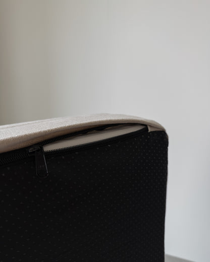 The cover unzipped at the corner, showing the zip and the non-slip base
